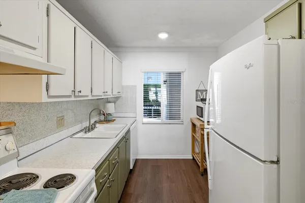 a kitchen with a sink and cabinets