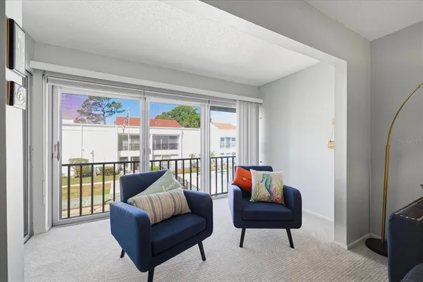 a living room with furniture and a large window