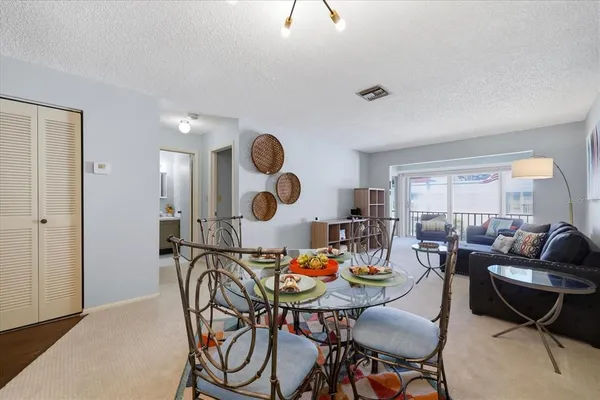 a kitchen with a sink a refrigerator and cabinets