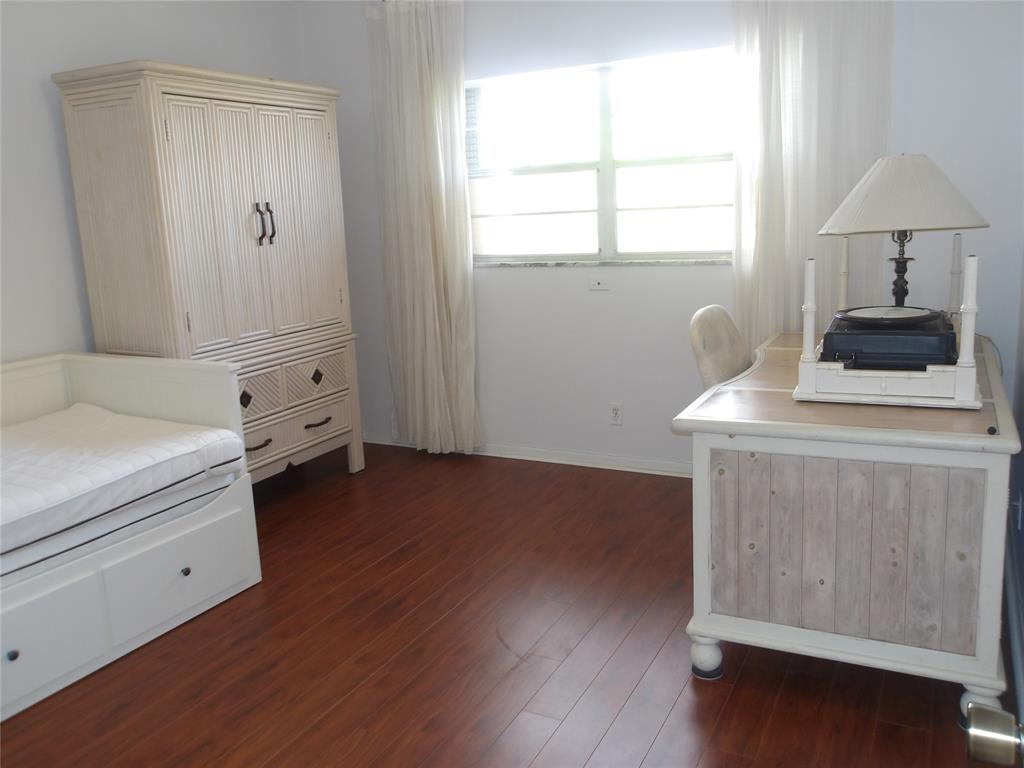 6731 Cypress Road, Unit 309 Plantation, FL 33317 - Photo 11 of 24 a room with a bed and a window
