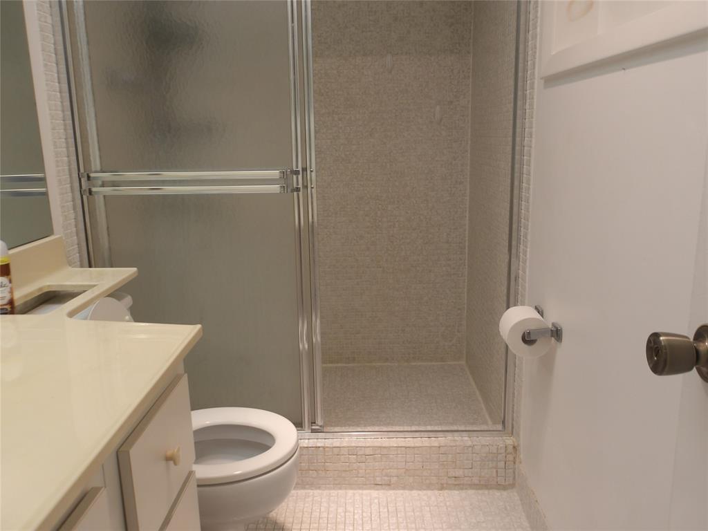 6731 Cypress Road, Unit 309 Plantation, FL 33317 - Photo 16 of 24 a bathroom with a toilet and a shower