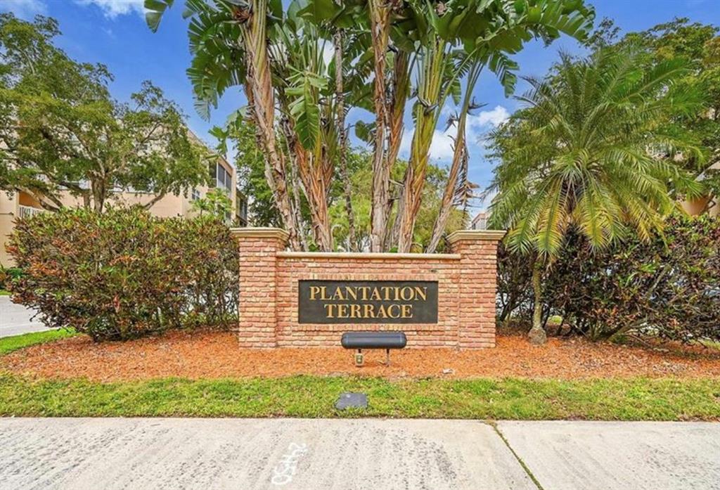 6731 Cypress Road, Unit 309 Plantation, FL 33317 - Photo 21 of 24 a sign that is sitting in front of a tree