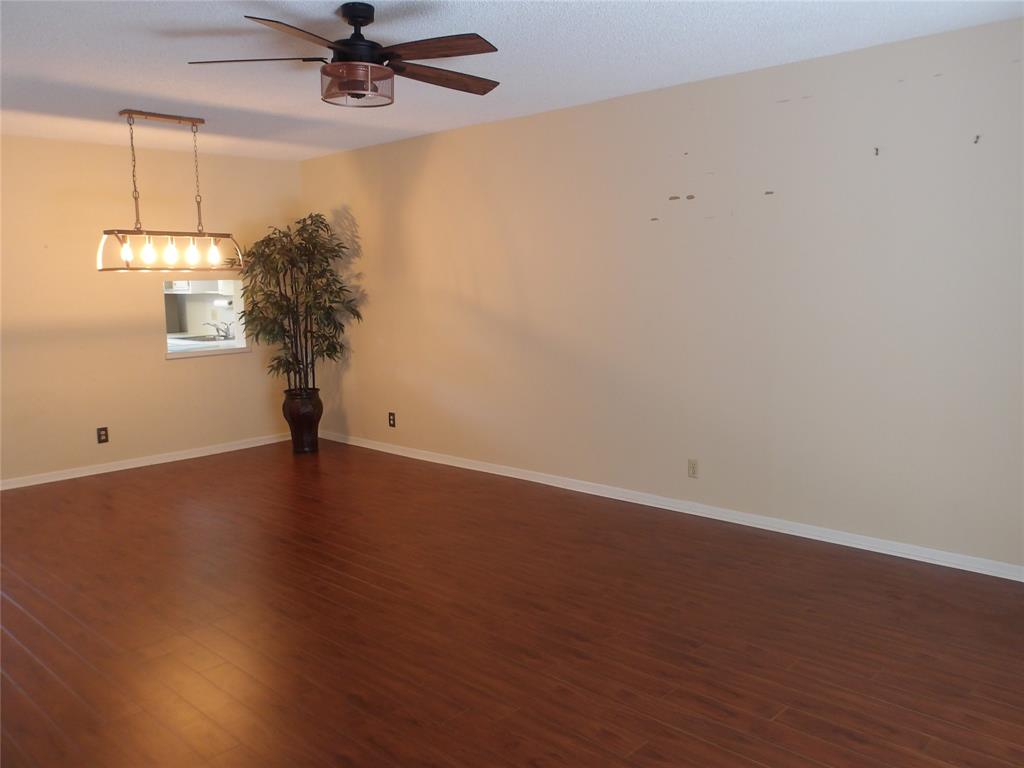 6731 Cypress Road, Unit 309 Plantation, FL 33317 - Photo 6 of 24 an empty room with a window and a ceiling fan