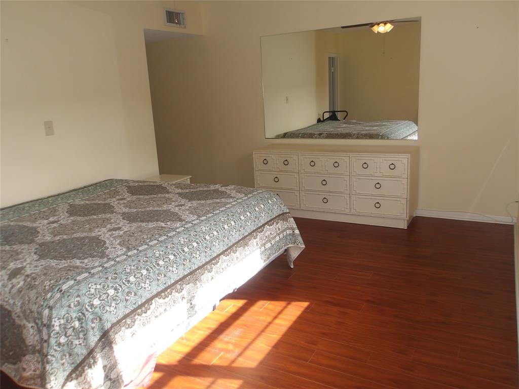 6731 Cypress Road, Unit 309 Plantation, FL 33317 - Photo 8 of 24 a bedroom with a bed and a dresser