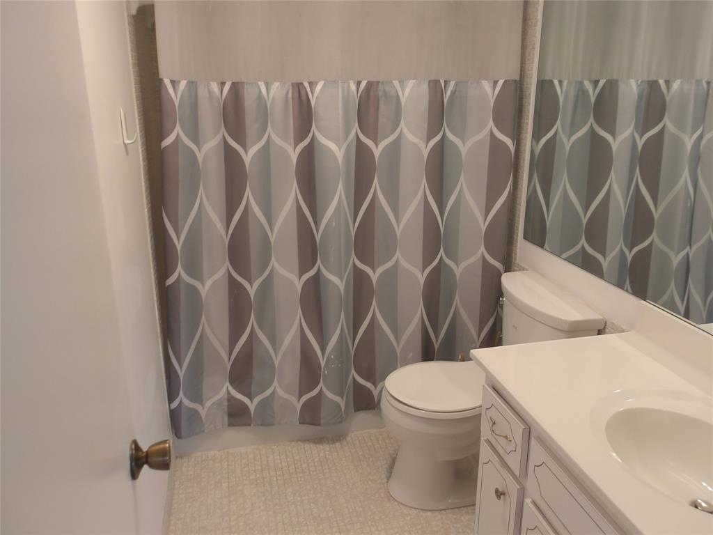 6731 Cypress Road, Unit 309 Plantation, FL 33317 - Photo 9 of 24 a bathroom with a toilet and a sink