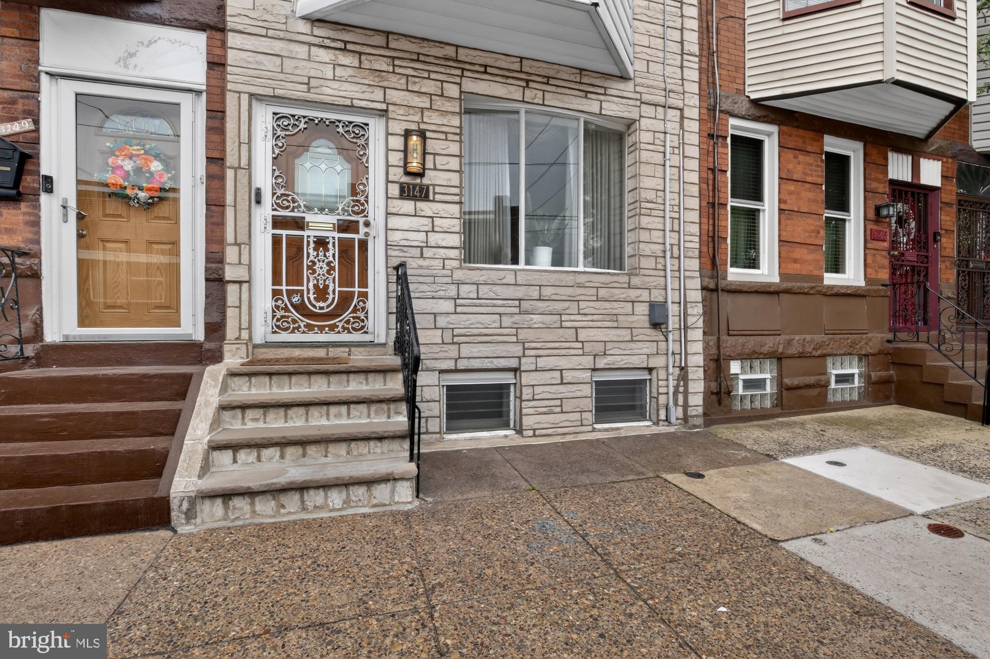3147 Edgemont Street Philadelphia, PA 19134 - Photo 22 of 23 a front view of a house with a garage