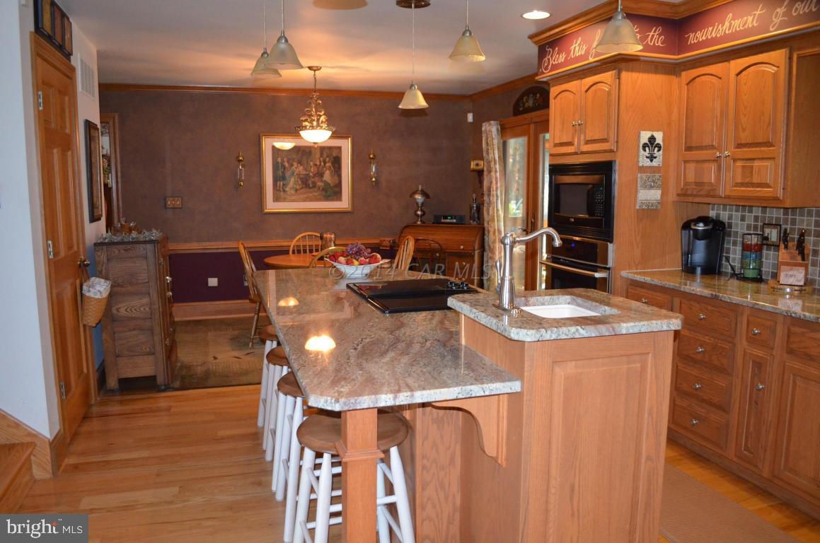 309 Silva Road Stockton, MD 21864 - Photo 23 of 67 a kitchen with a sink and cabinets