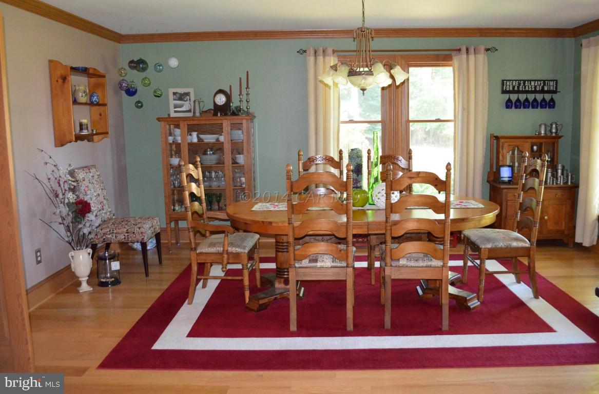309 Silva Road Stockton, MD 21864 - Photo 28 of 67 a living room with lots of furniture and a rug