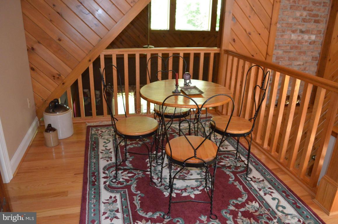 309 Silva Road Stockton, MD 21864 - Photo 39 of 67 a view of a chairs and table in the balcony