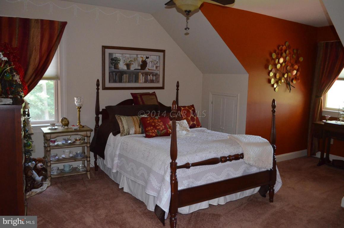 309 Silva Road Stockton, MD 21864 - Photo 43 of 67 a bed sitting in a bedroom next to a window
