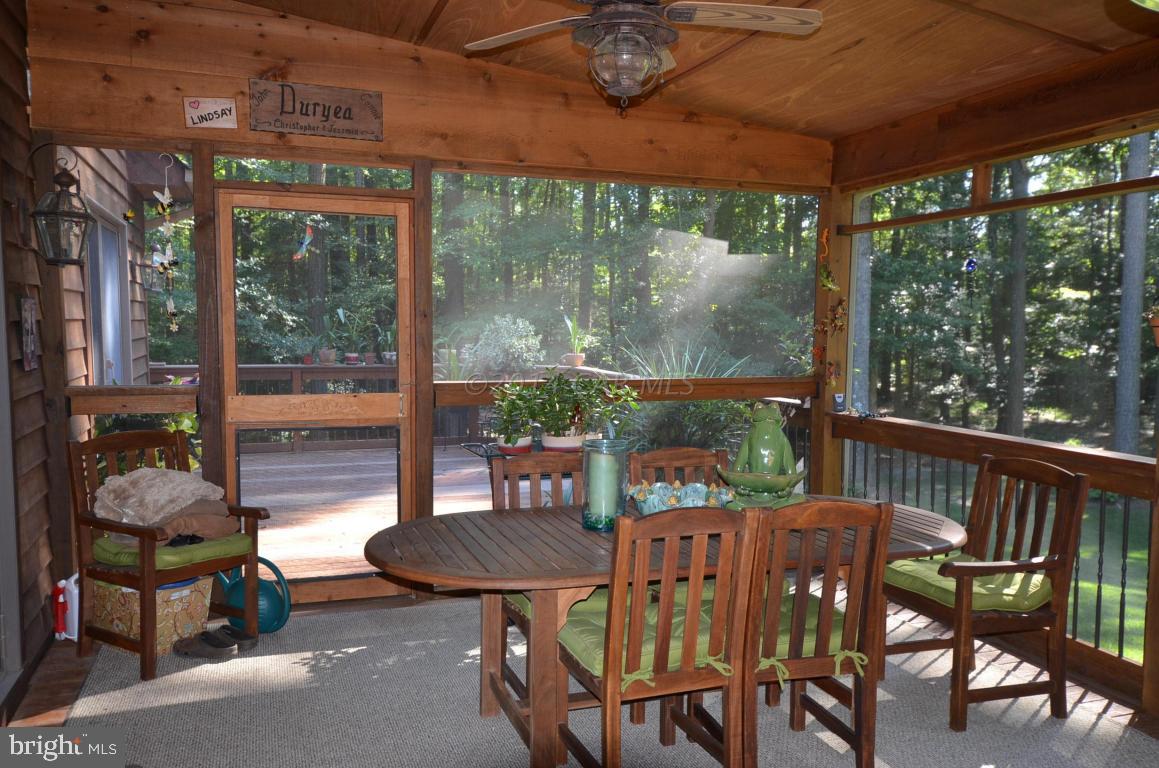 309 Silva Road Stockton, MD 21864 - Photo 46 of 67 a view of a patio with a table chairs and a table