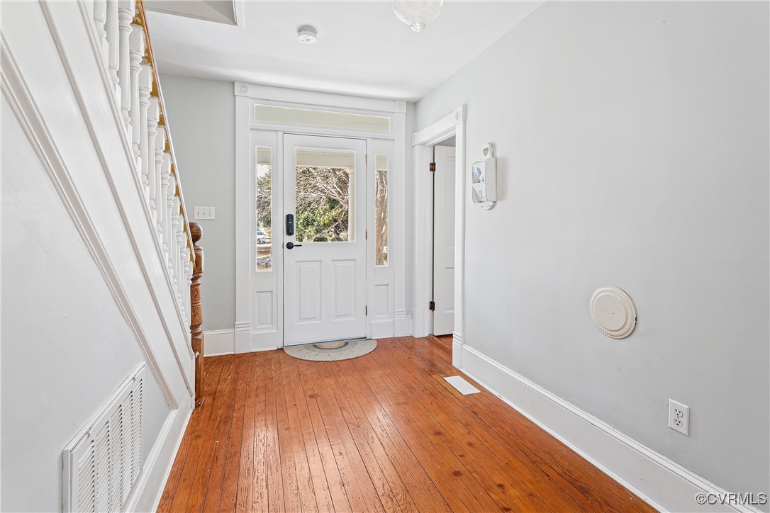 1092 Hull Neck Road Heathsville, VA 22473 - Photo 12 of 50 Foyer featuring stairs, Original heart pine floors