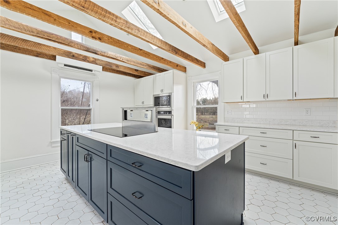 1092 Hull Neck Road Heathsville, VA 22473 - Photo 18 of 50 Kitchen featuring white cabinetry, stainless steel