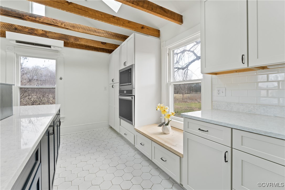 1092 Hull Neck Road Heathsville, VA 22473 - Photo 23 of 50 Kitchen with white cabinets,quartz counters, stain