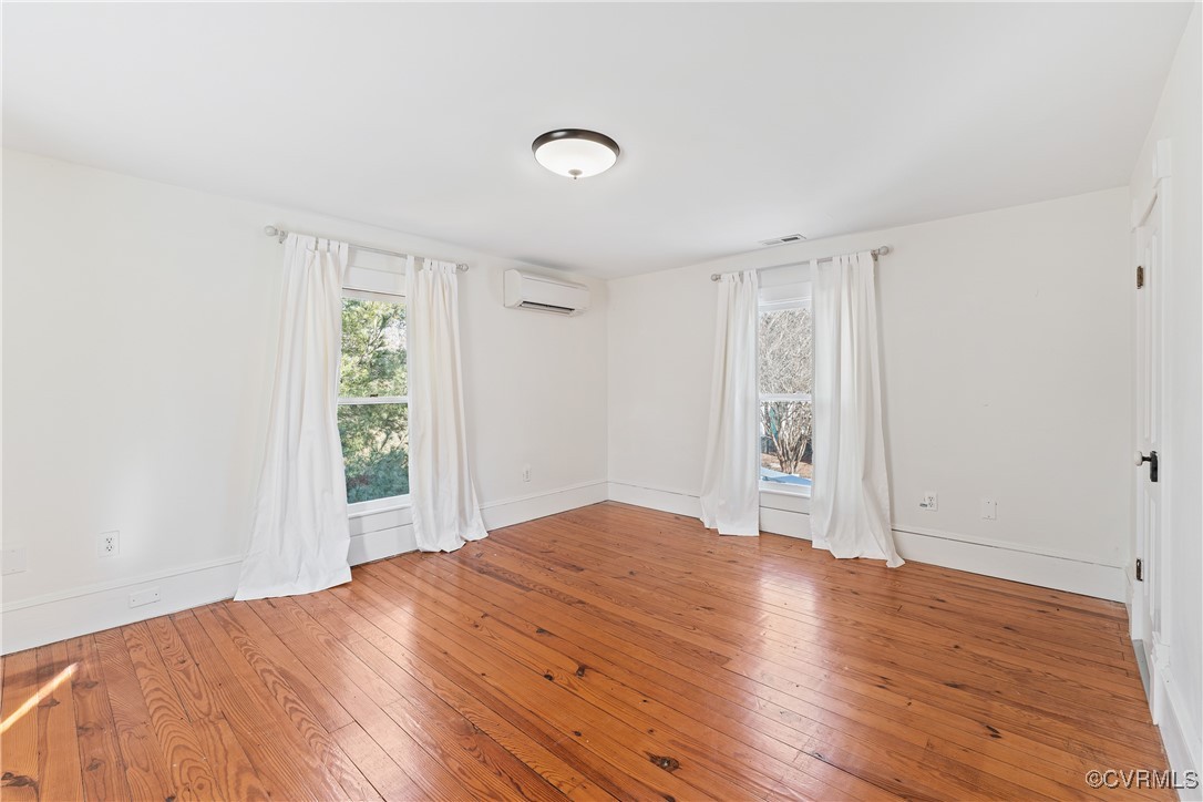1092 Hull Neck Road Heathsville, VA 22473 - Photo 37 of 50 Original heart pine floors, a wall mounted mini sp