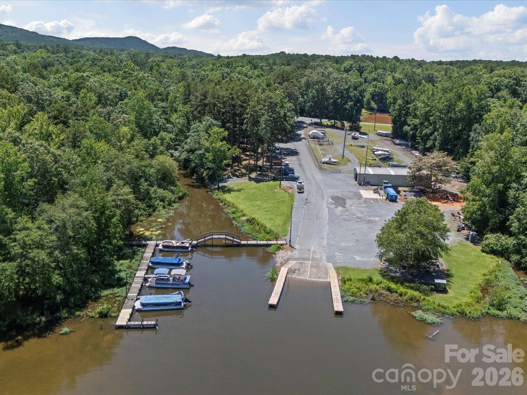 293 Manchester Road Mount Gilead, NC 27306 - Photo 8 of 18 an aerial view of a house with outdoor space swimming pool and mountains