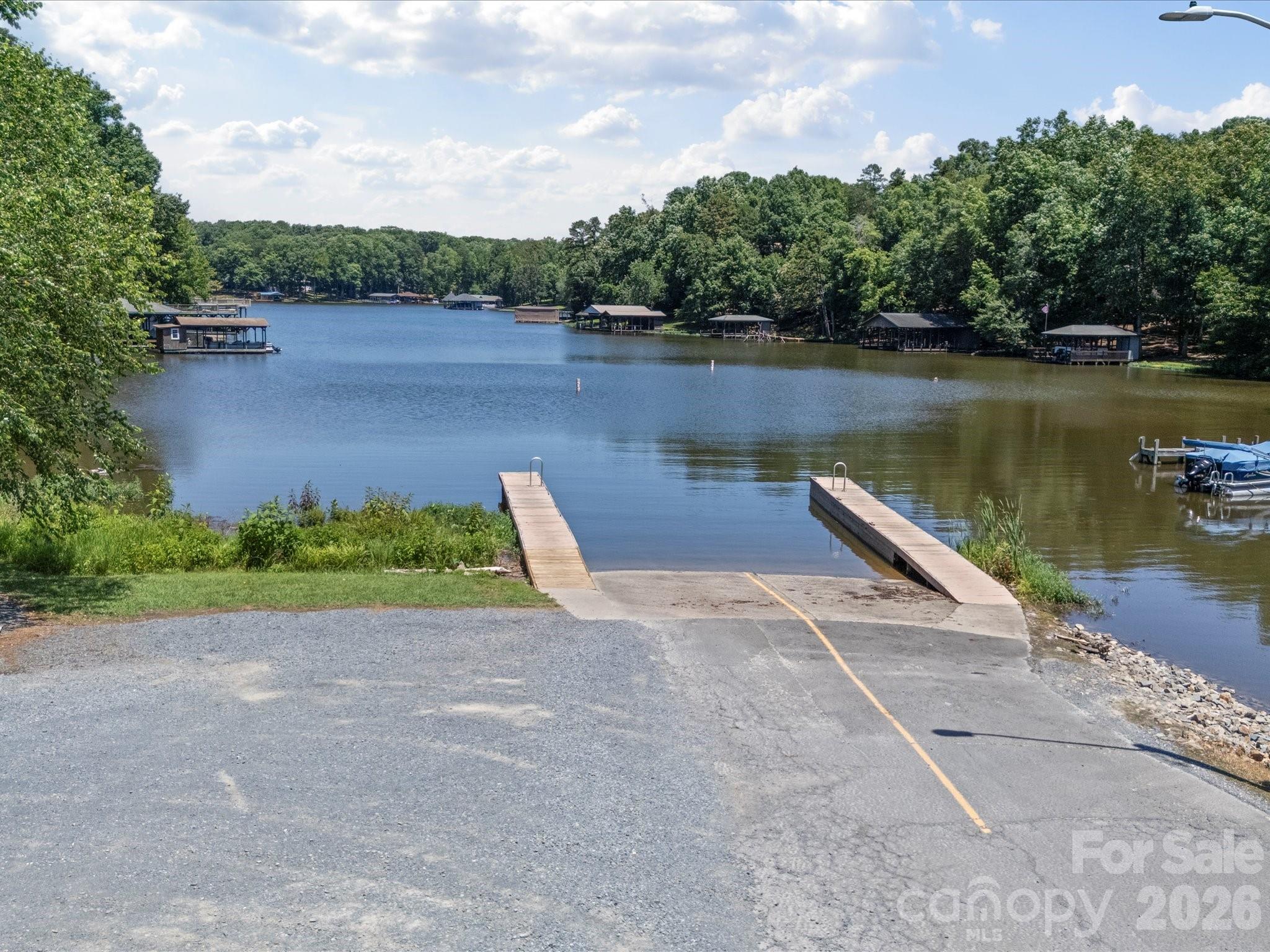 293 Manchester Road Mount Gilead, NC 27306 - Photo 9 of 18 a view of a lake with a large trees