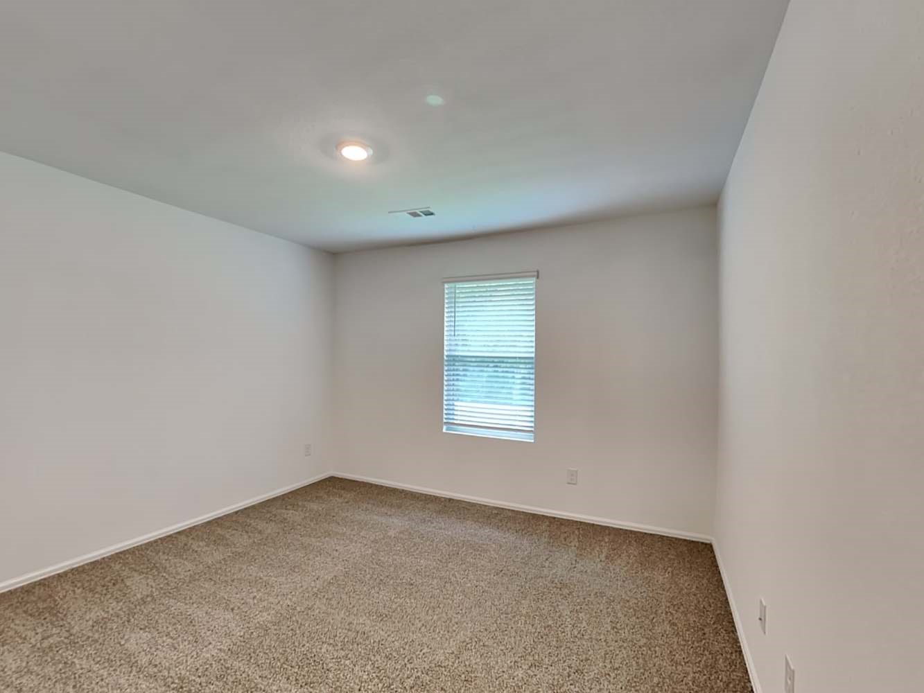 18606 Via Barletta Lane New Caney, TX 77357 - Photo 12 of 16 an empty room with a window