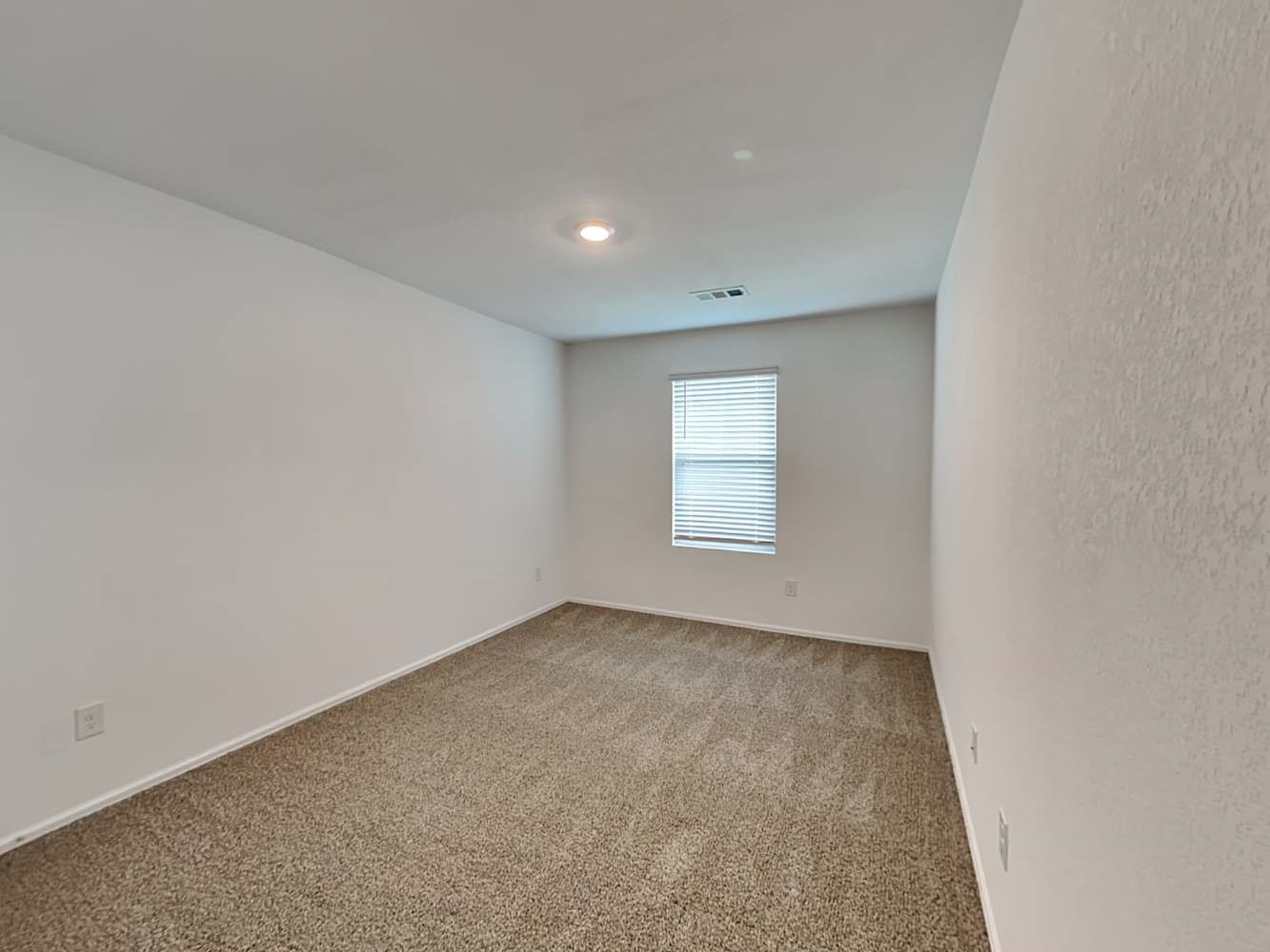 18606 Via Barletta Lane New Caney, TX 77357 - Photo 13 of 16 an empty room with a window