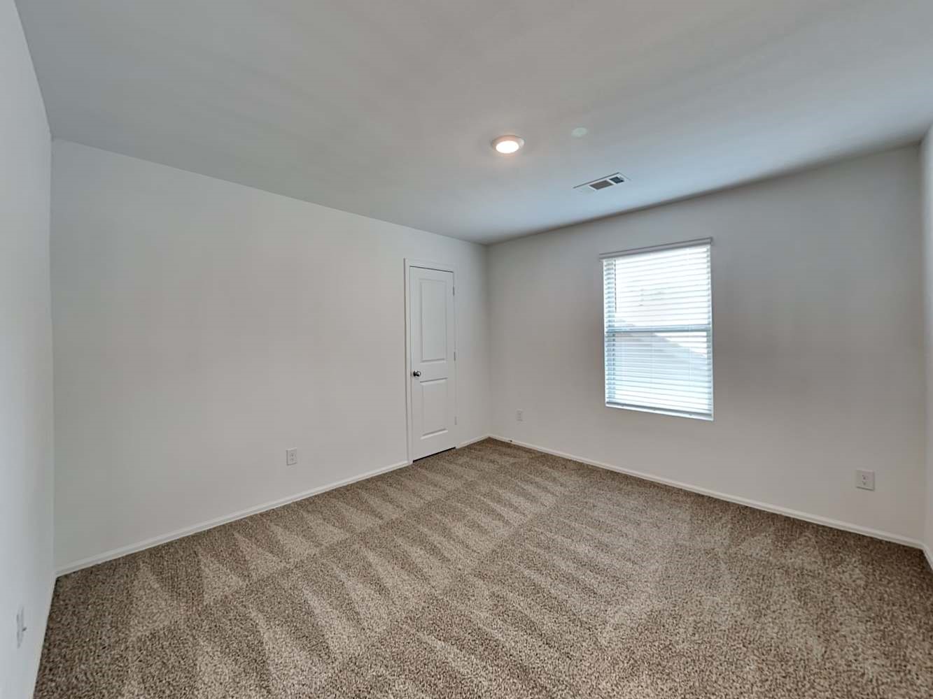 18606 Via Barletta Lane New Caney, TX 77357 - Photo 9 of 16 an empty room with a window