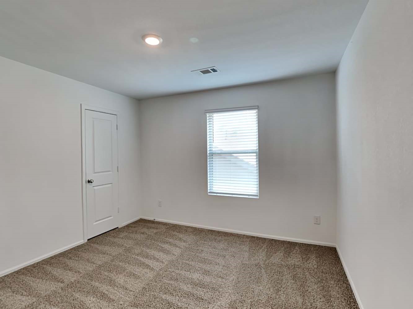 18606 Via Barletta Lane New Caney, TX 77357 - Photo 10 of 16 an empty room with a window