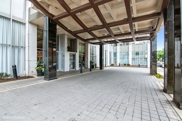 655 West Irving Park Road, Unit 2311 Chicago, IL 60613 - Photo 2 of 21 a view of porch with a table and chairs