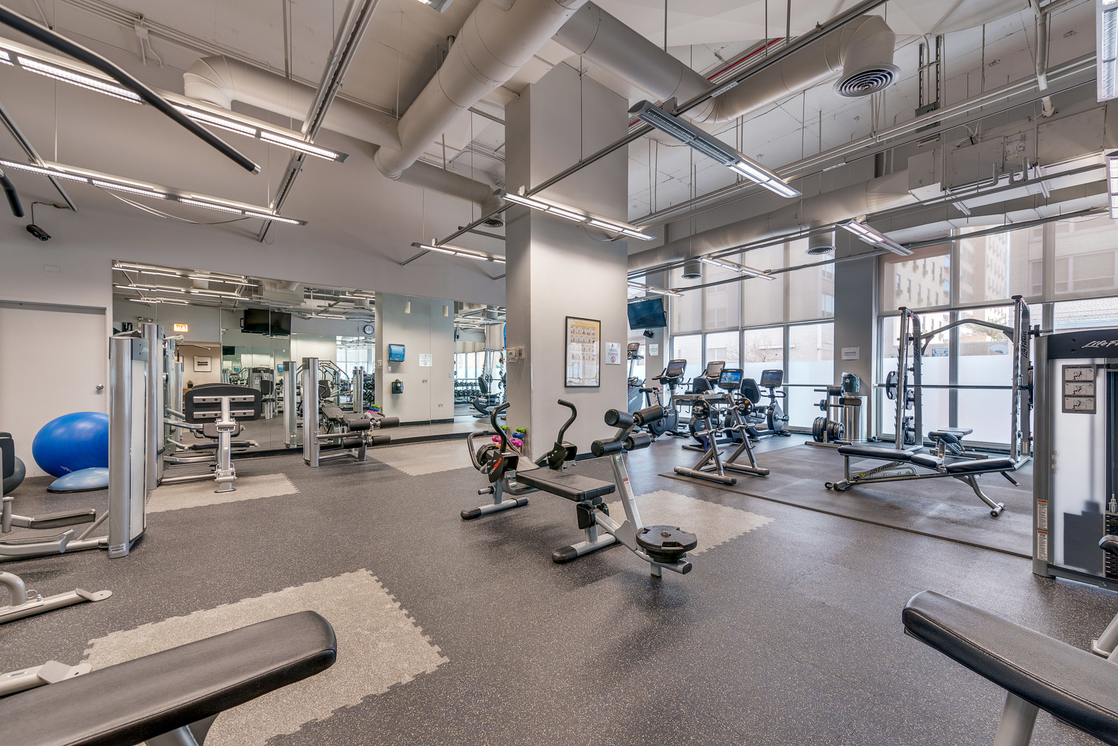 655 West Irving Park Road, Unit 2311 Chicago, IL 60613 - Photo 19 of 21 a view of a room with gym equipment