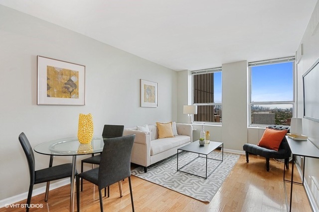 655 West Irving Park Road, Unit 2311 Chicago, IL 60613 - Photo 3 of 21 a living room with furniture and a window