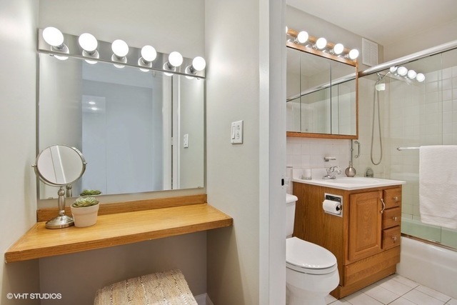 655 West Irving Park Road, Unit 2311 Chicago, IL 60613 - Photo 10 of 21 a bathroom with a sink toilet and shower