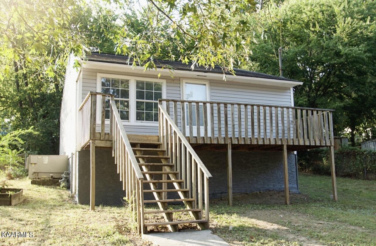 145 Johnson Road Oak Ridge, TN 37830 - Photo 1 of 26 a view of a house with backyard