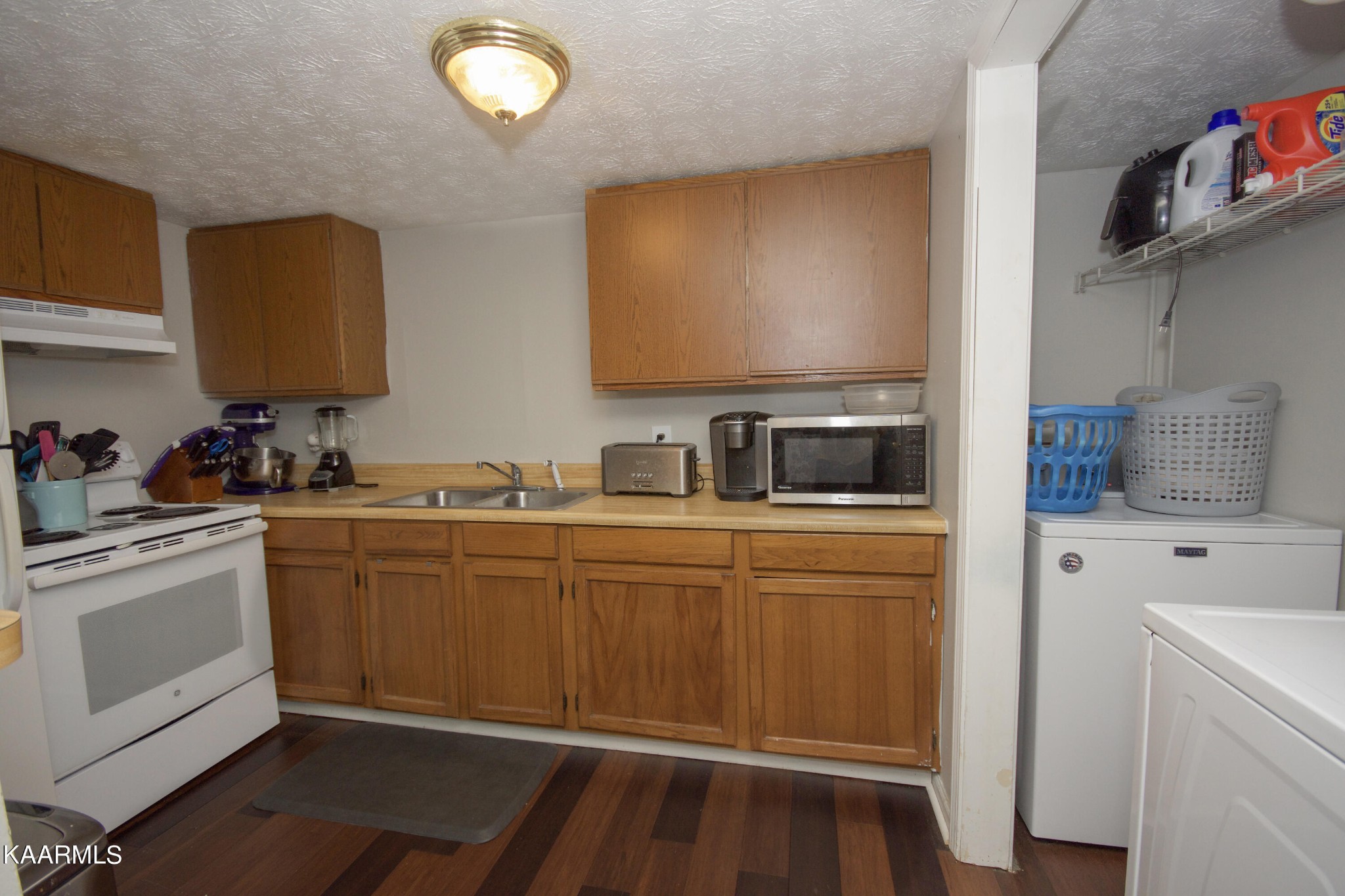 145 Johnson Road Oak Ridge, TN 37830 - Photo 12 of 26 a kitchen with a sink and cabinets