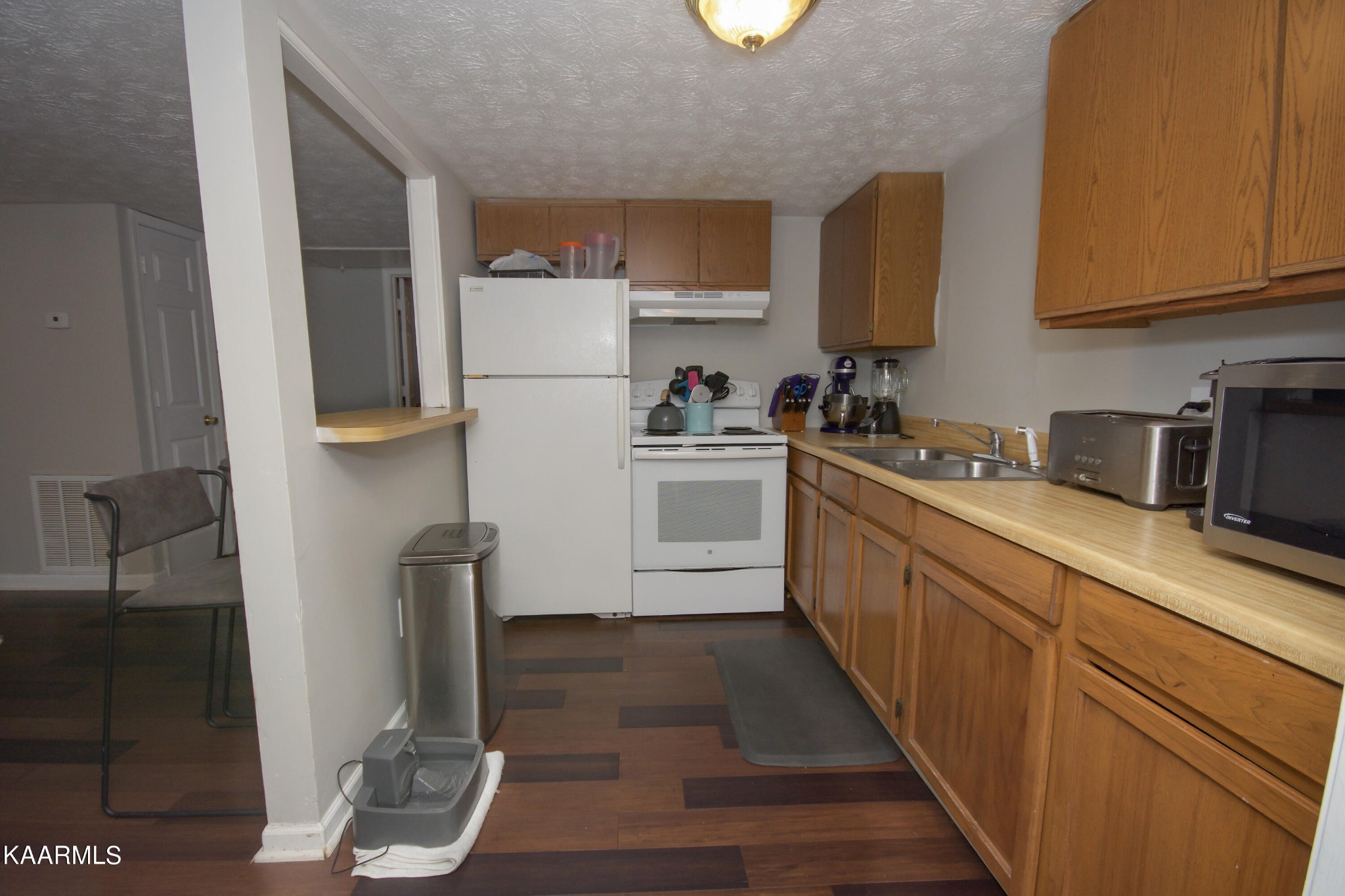 145 Johnson Road Oak Ridge, TN 37830 - Photo 13 of 26 a kitchen with a sink a stove and cabinets