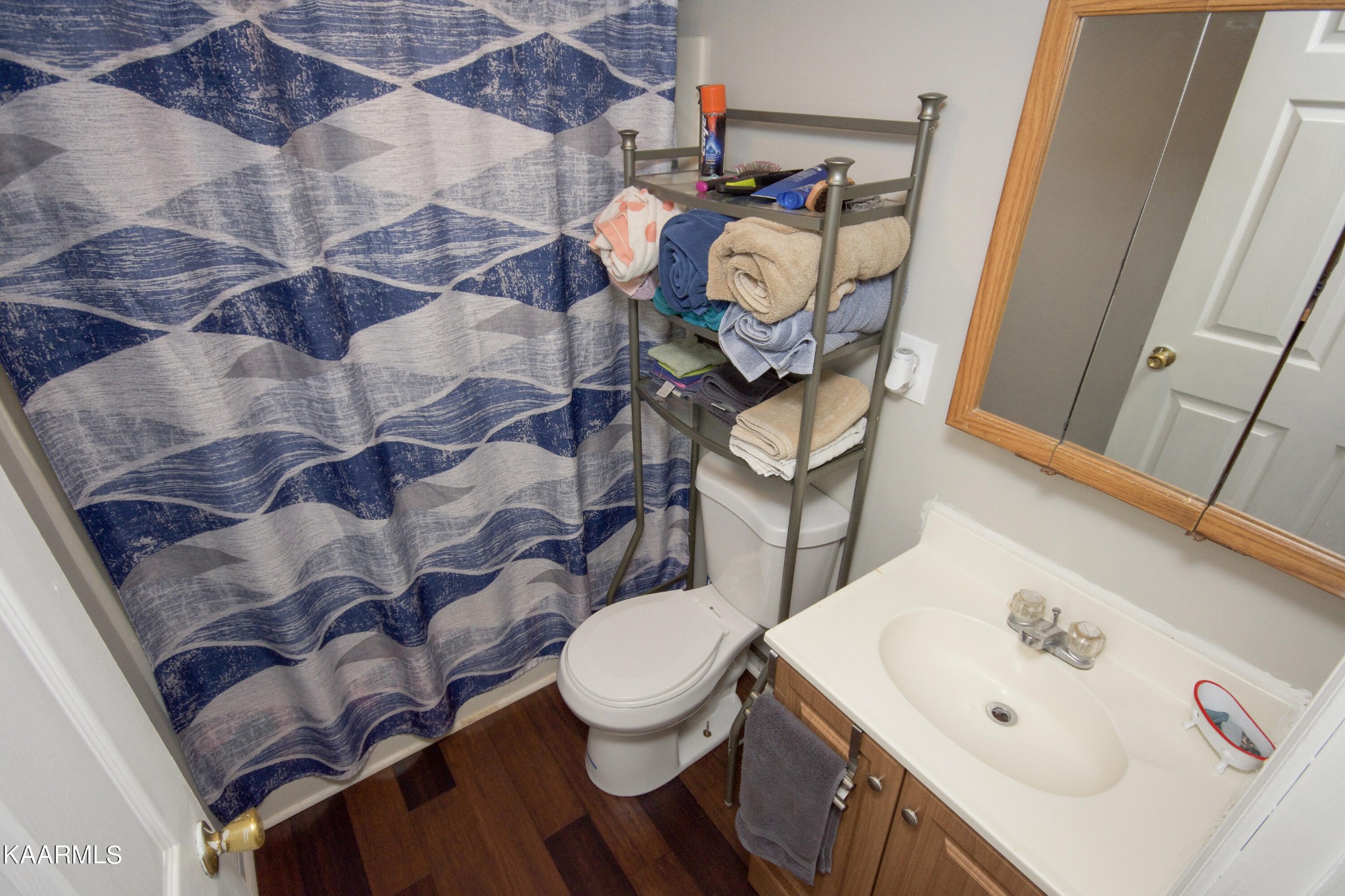 145 Johnson Road Oak Ridge, TN 37830 - Photo 19 of 26 a bathroom with a sink and mirror with toilet