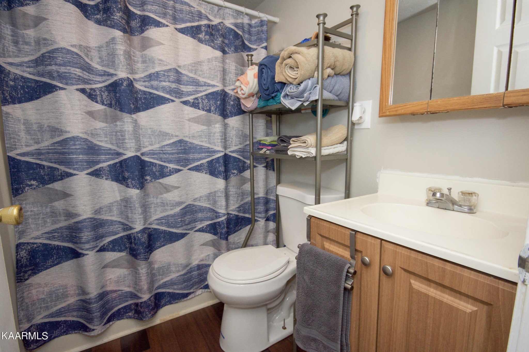 145 Johnson Road Oak Ridge, TN 37830 - Photo 20 of 26 a bathroom with a sink a toilet and shower
