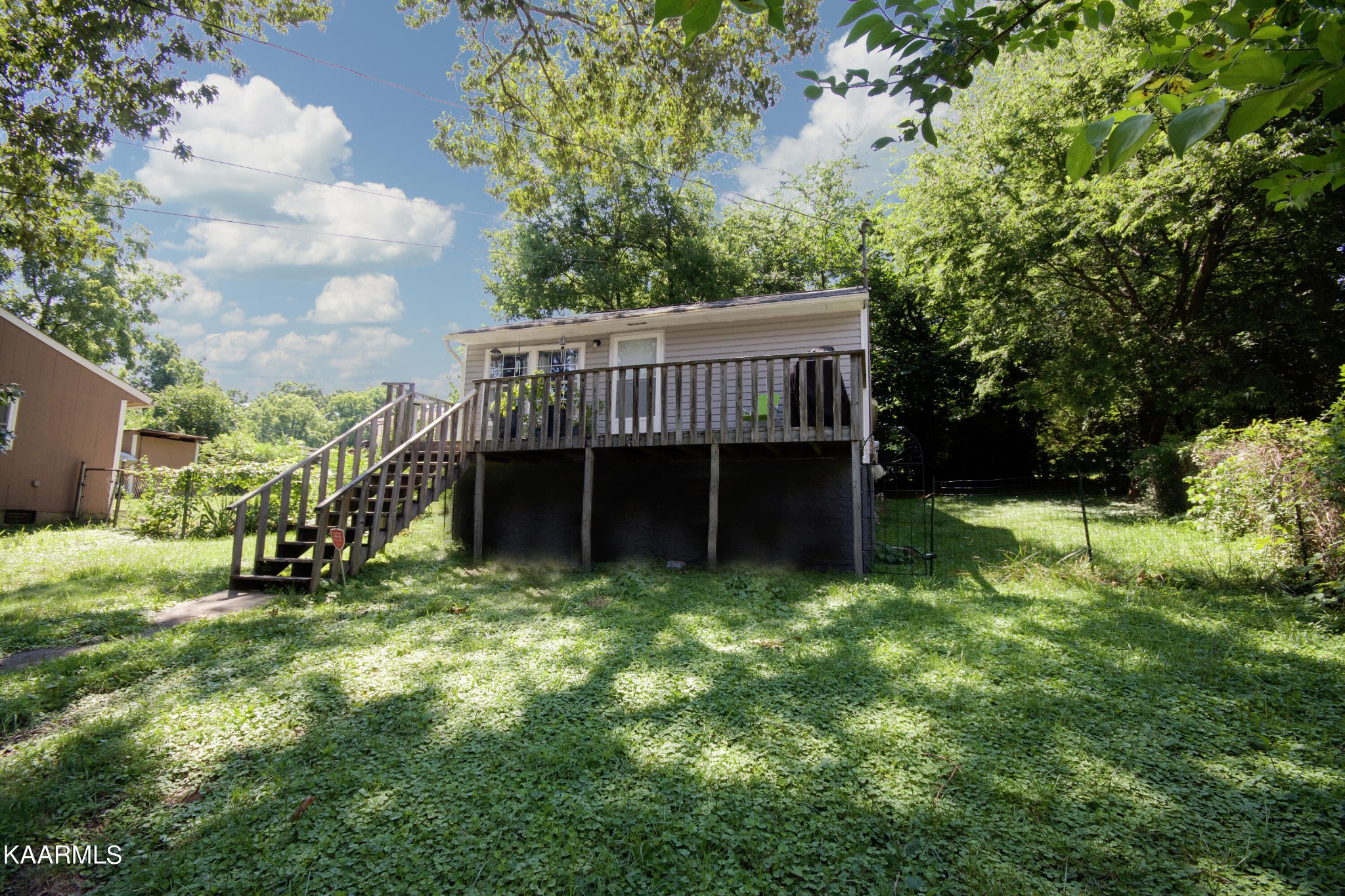 145 Johnson Road Oak Ridge, TN 37830 - Photo 2 of 26 a view of a house with a backyard and a tree