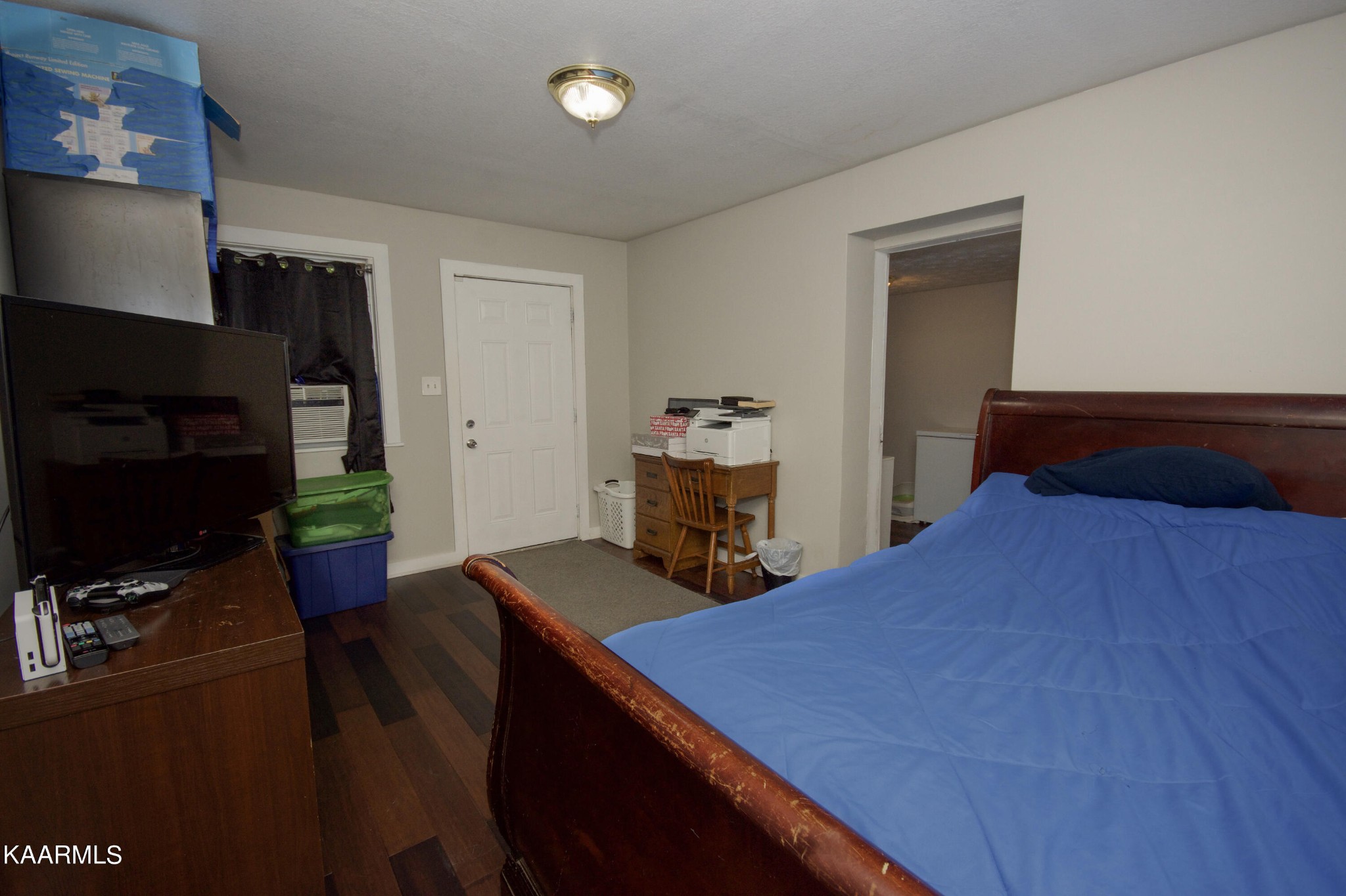 145 Johnson Road Oak Ridge, TN 37830 - Photo 24 of 26 a bedroom with a bed and a tv on the table