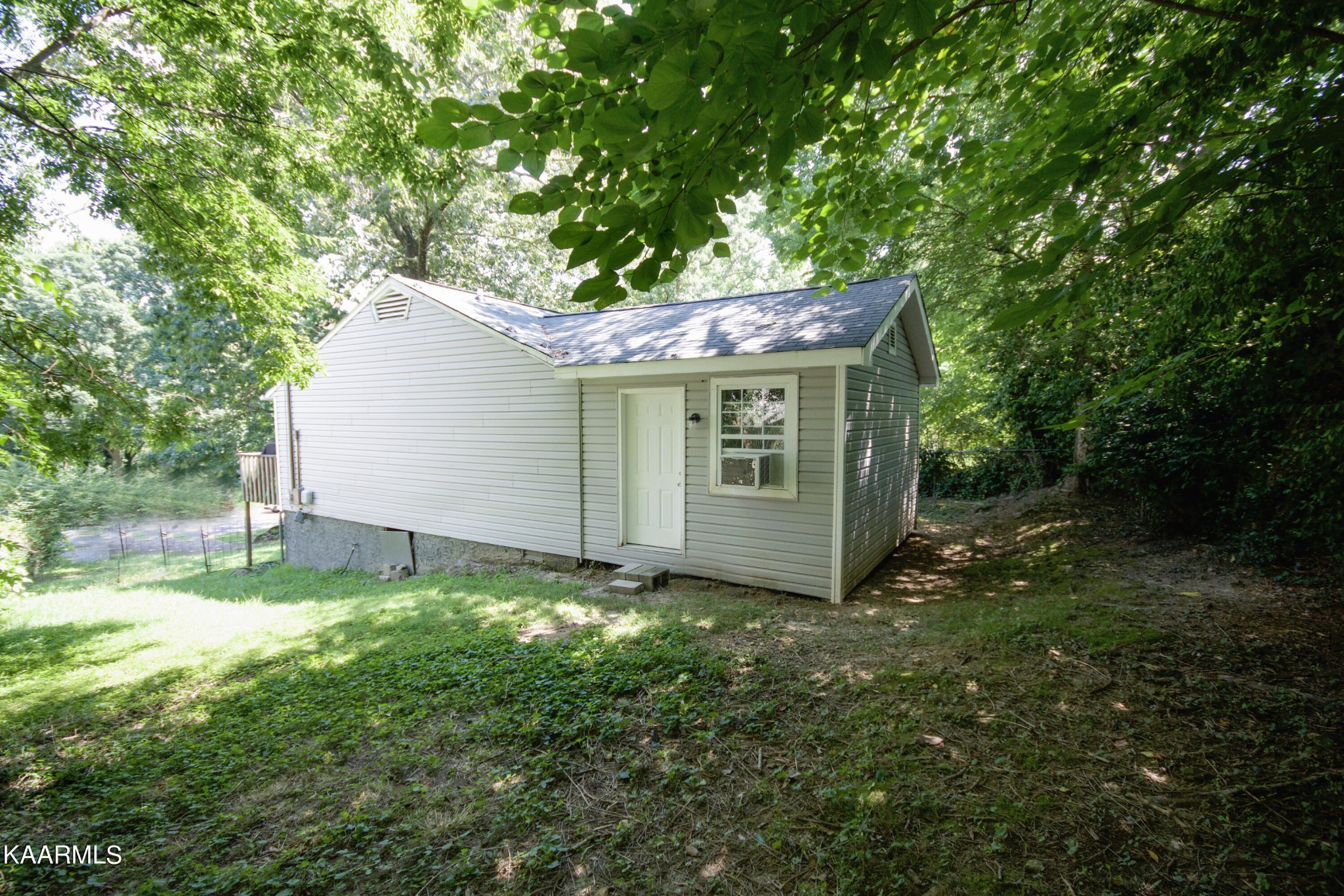 145 Johnson Road Oak Ridge, TN 37830 - Photo 26 of 26 a view of a house with a yard and large trees