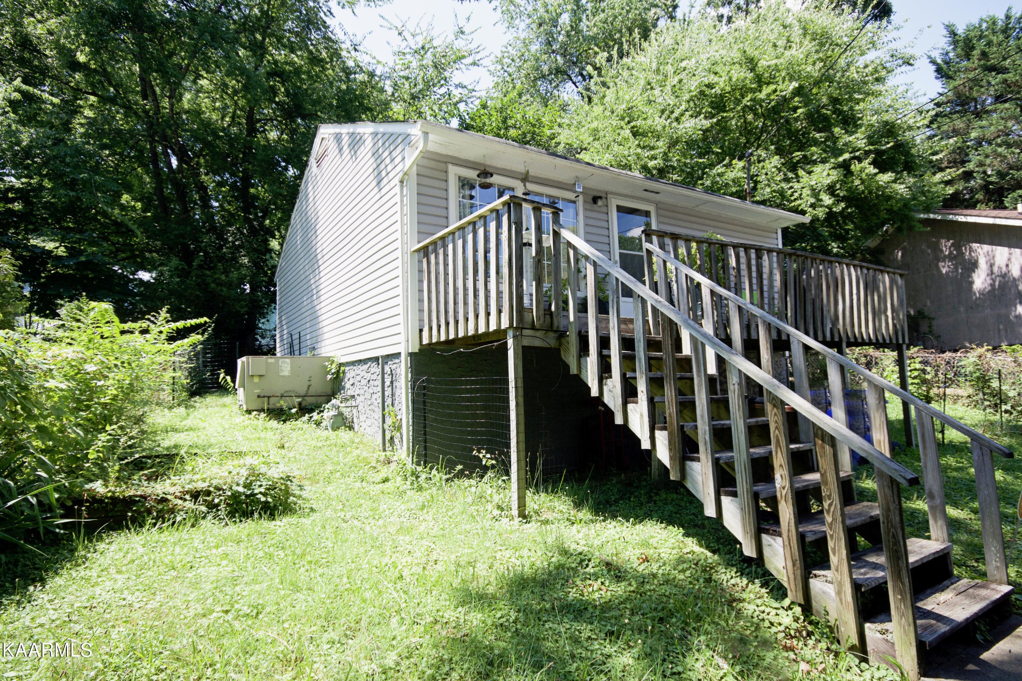 145 Johnson Road Oak Ridge, TN 37830 - Photo 5 of 26 a view of backyard with deck and garden