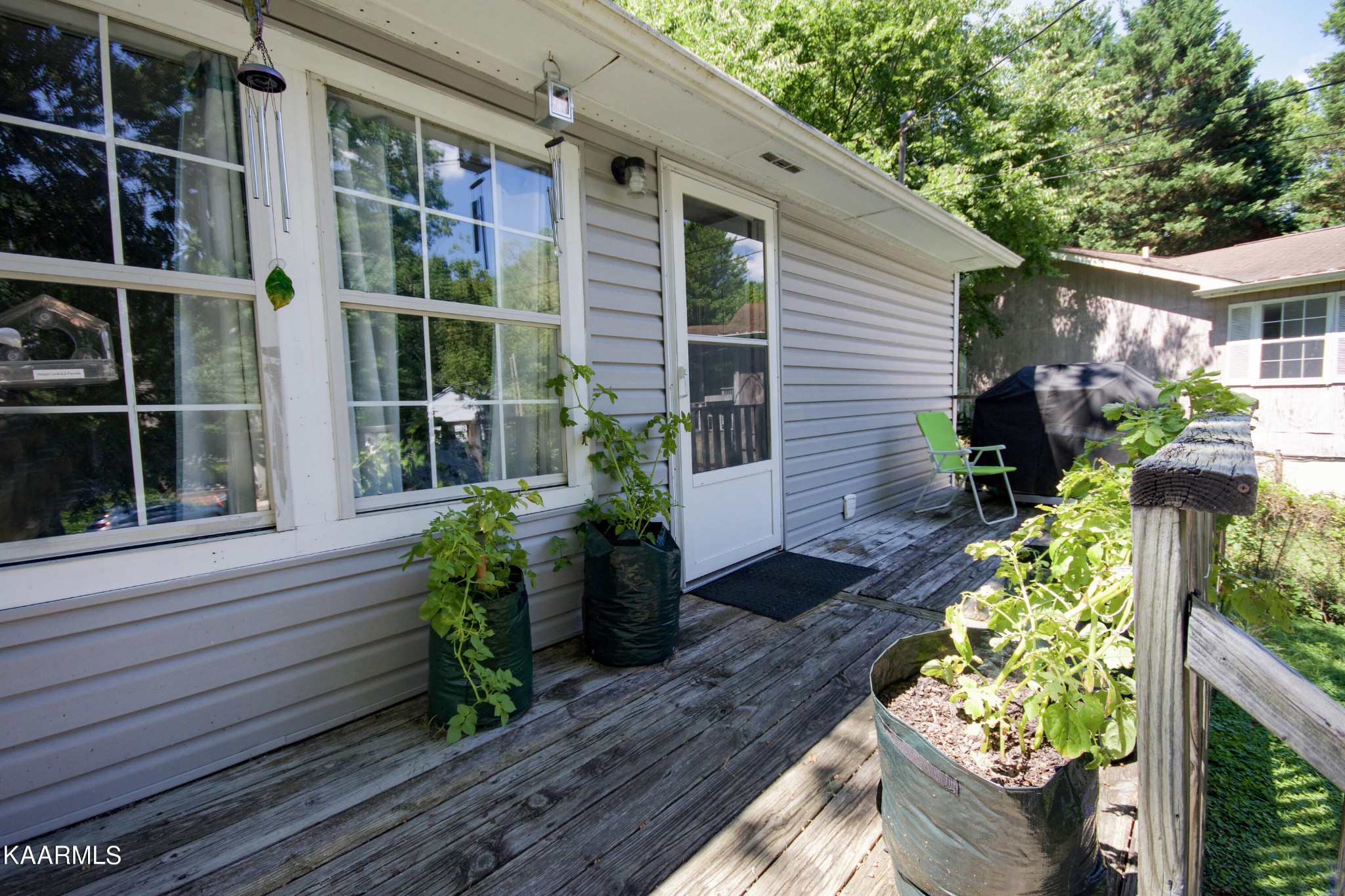 145 Johnson Road Oak Ridge, TN 37830 - Photo 6 of 26 a house with potted plants in front of it