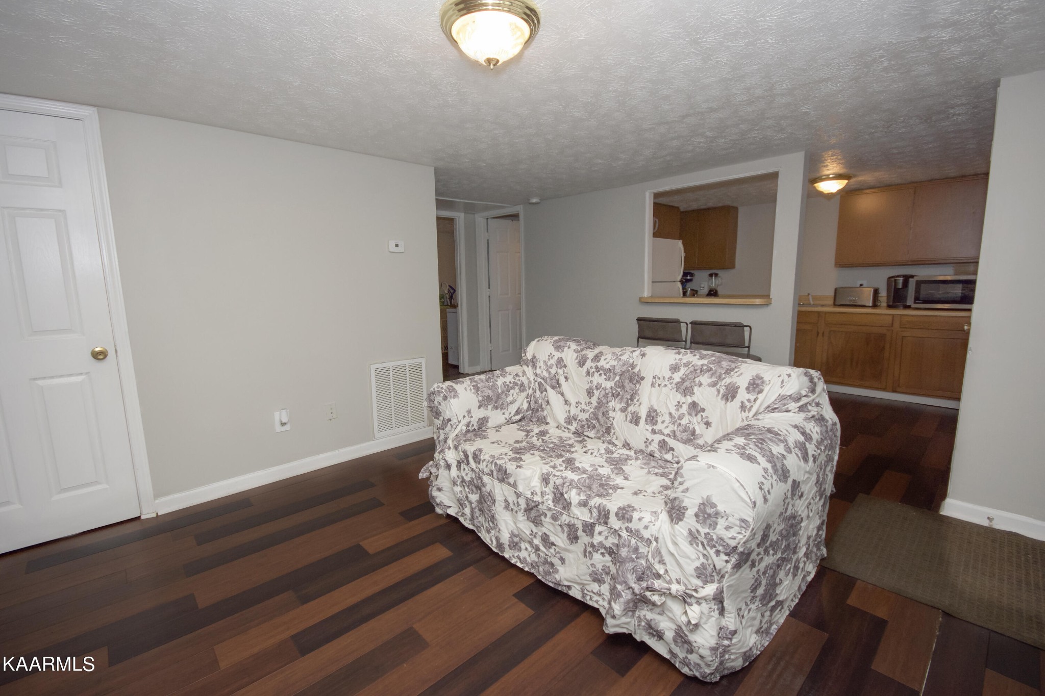 145 Johnson Road Oak Ridge, TN 37830 - Photo 8 of 26 a living room with furniture and a wooden floor
