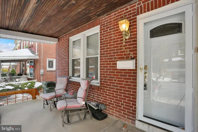 a couple of chairs in front of door