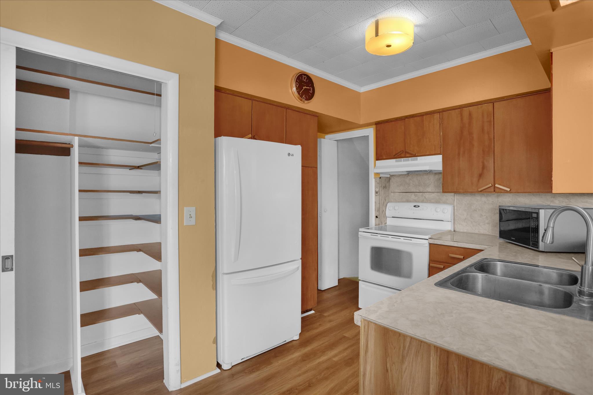 505 Friedensburg Road Reading, PA 19606 - Photo 10 of 40 a kitchen with stainless steel appliances a refrigerator a sink and wooden cabinets