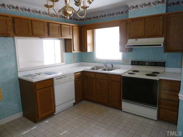 5608 Spring Pines Way Raleigh, NC 27616 - Photo 3 of 15 a kitchen with a sink stove and window