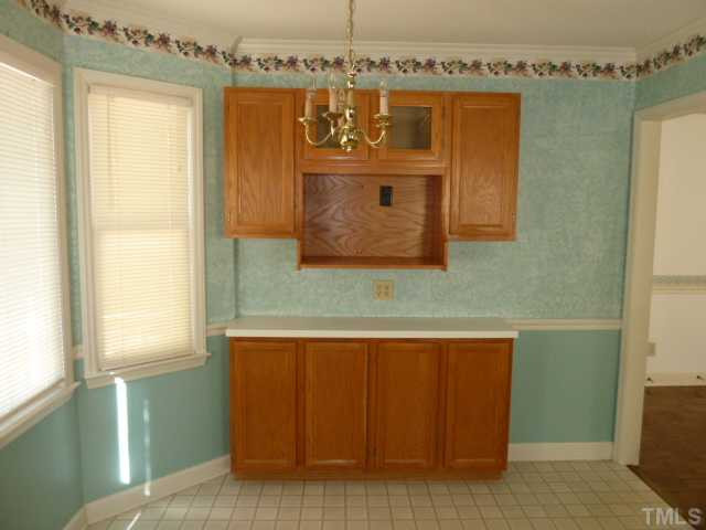 5608 Spring Pines Way Raleigh, NC 27616 - Photo 5 of 15 a bathroom with a sink and a mirror