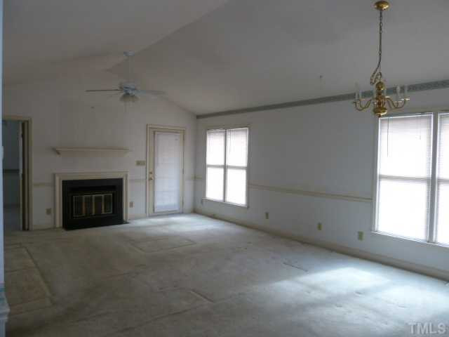 5608 Spring Pines Way Raleigh, NC 27616 - Photo 6 of 15 a view of empty room with a fireplace