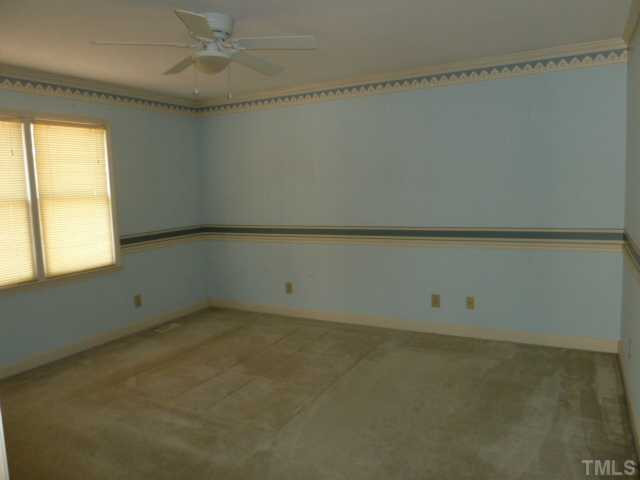 5608 Spring Pines Way Raleigh, NC 27616 - Photo 7 of 15 an empty room with a window