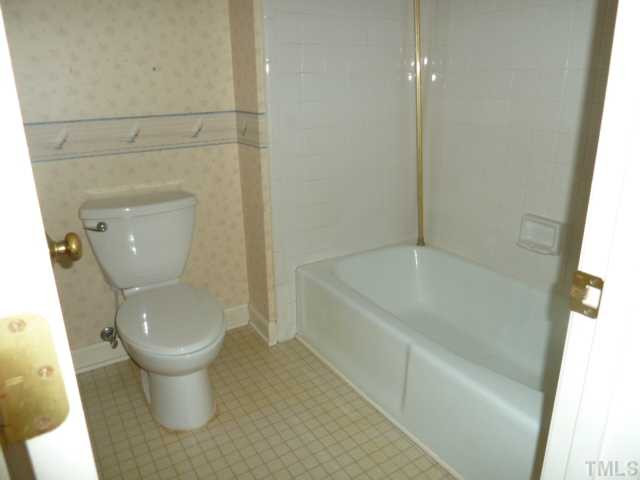 5608 Spring Pines Way Raleigh, NC 27616 - Photo 8 of 15 a bathroom with a toilet and a bathtub