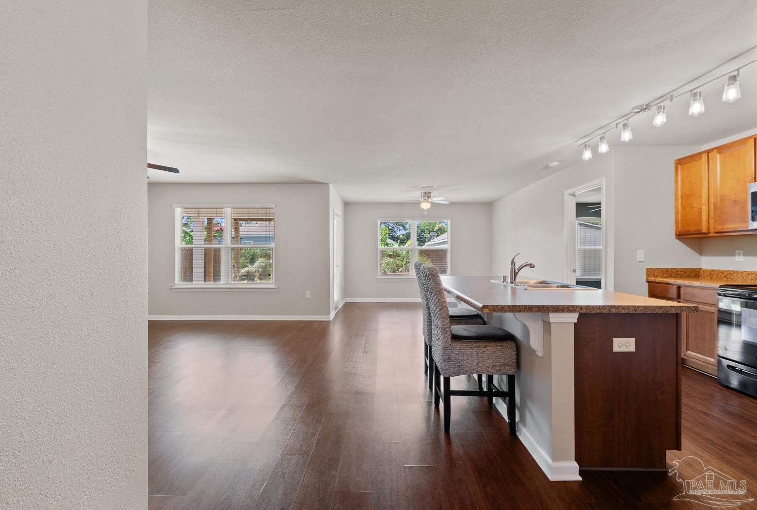 17438 Harding Drive Foley, AL 36535 - Photo 12 of 56 a view of a dining room with furniture and wooden floor