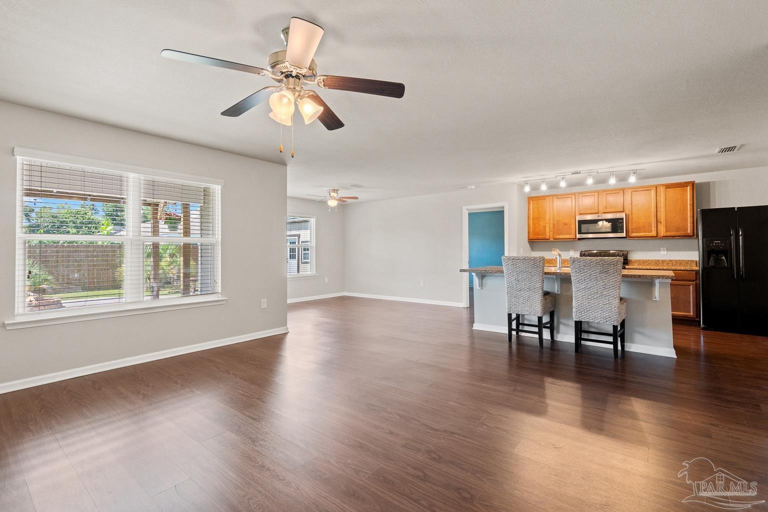17438 Harding Drive Foley, AL 36535 - Photo 15 of 56 a view of a dining room with furniture and wooden floor