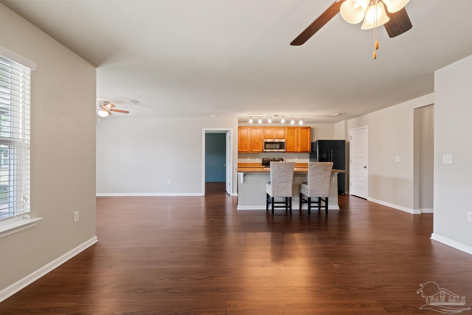 17438 Harding Drive Foley, AL 36535 - Photo 16 of 56 a view of a dining room with furniture and wooden floor